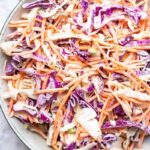 Close-up of keto coleslaw with creamy dressing and vibrant vegetables.