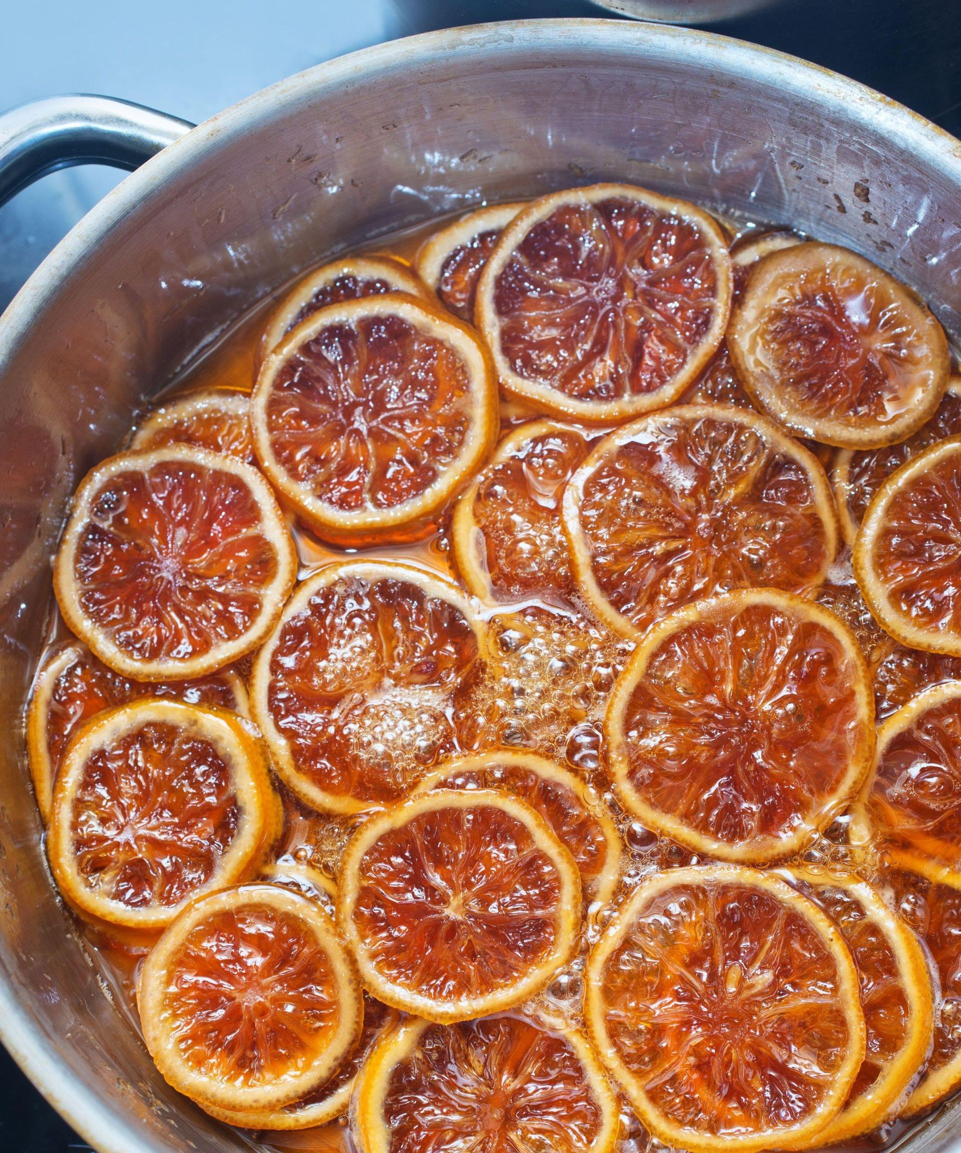 A simmer pot filled with orange slices and spices