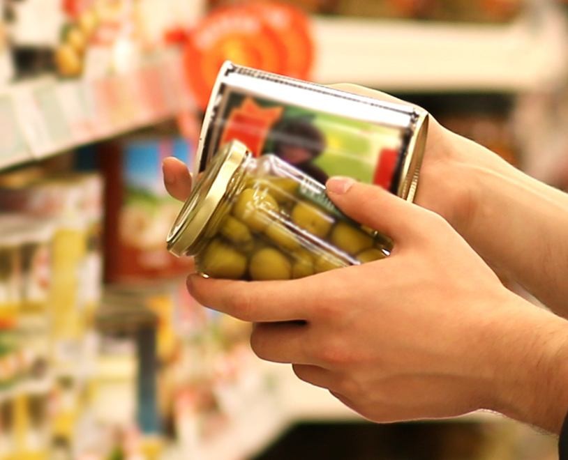 Labels being compared on two cans of food.