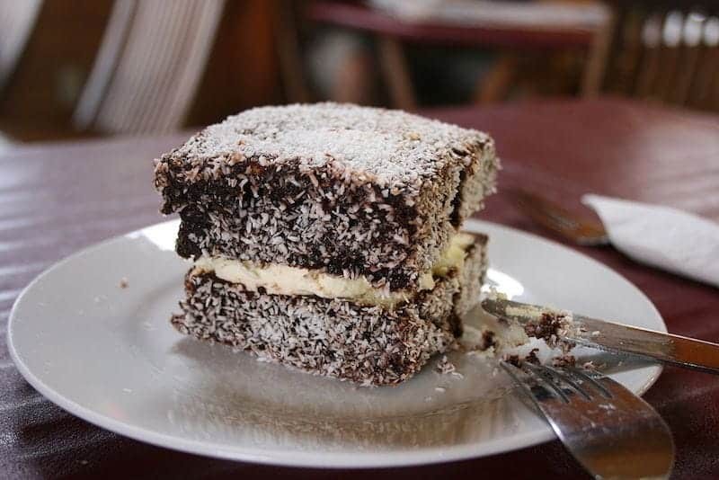 Popular Australian food - Lamington sponge cake, a sponge cake coated in chocolate sauce and coconut, a classic Australian dessert.
