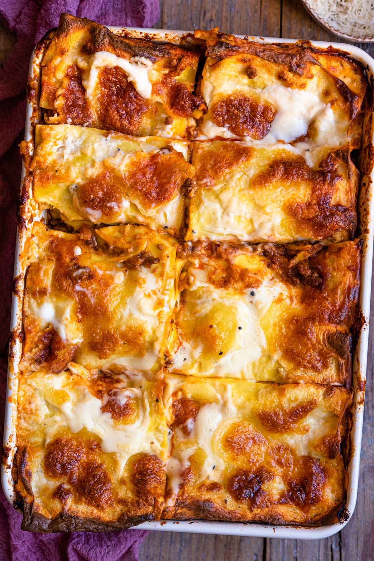 Overhead view of a freshly baked Italian lasagna with bubbly cheese