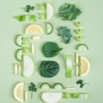 Woman enjoying a healthy salad with leafy greens and nuts, ingredients known to help alleviate migraine symptoms
