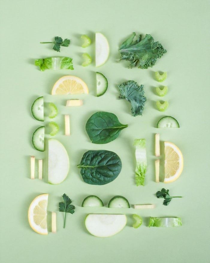 Woman enjoying a healthy salad with leafy greens and nuts, ingredients known to help alleviate migraine symptoms