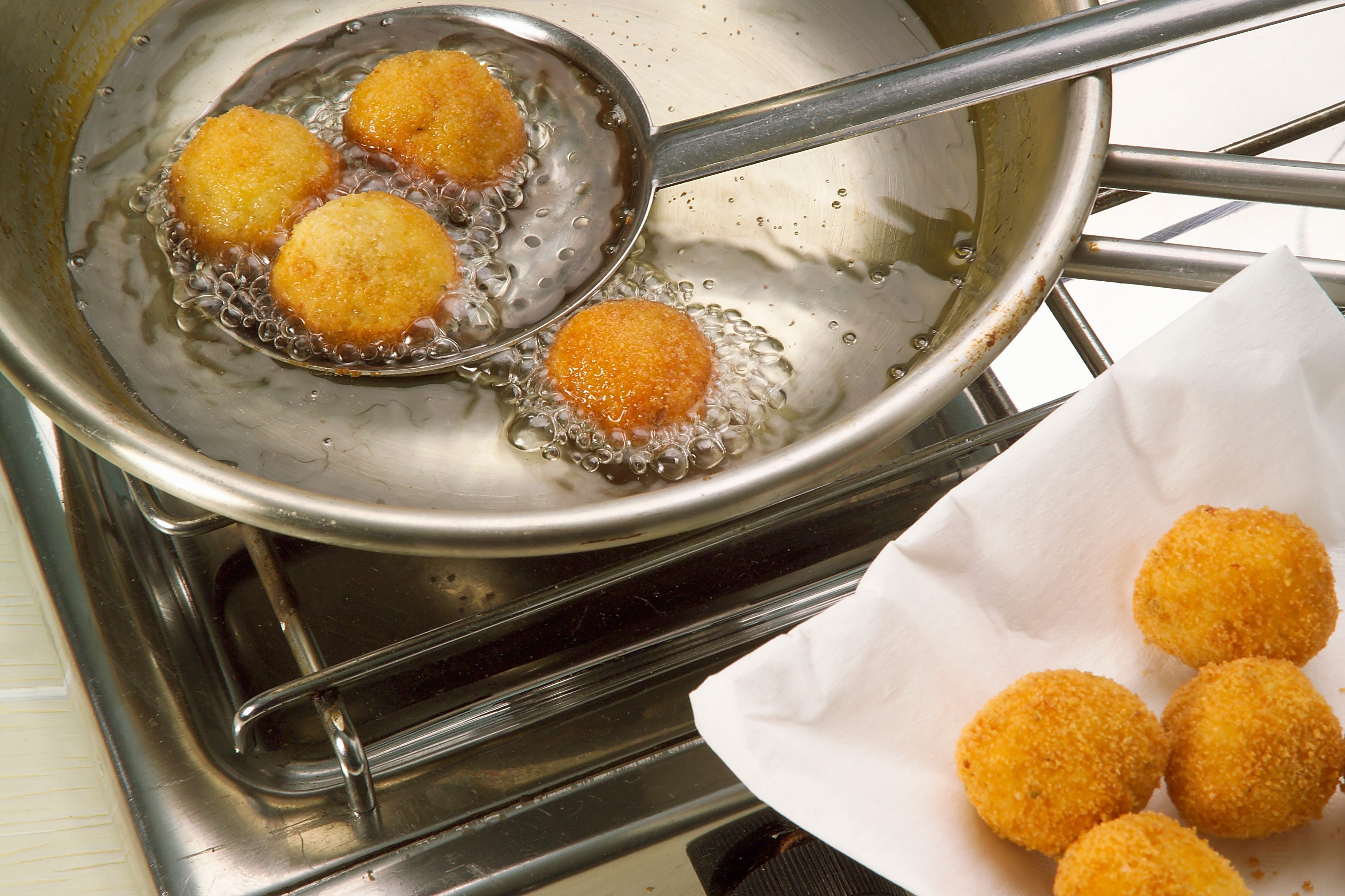 Close-up of deep-fried makouda potato balls, a popular Moroccan street food.