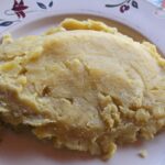 Steaming matooke, a staple in Ugandan cuisine, providing essential nutrients and carbohydrates