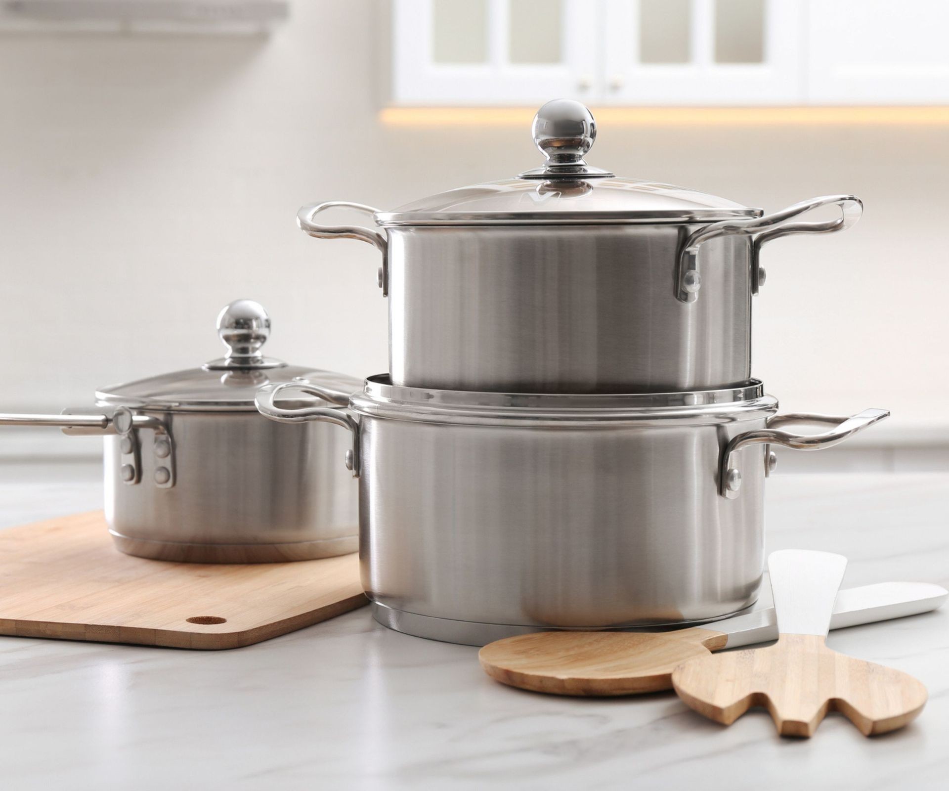 Stack of clean pans after removing burnt residue