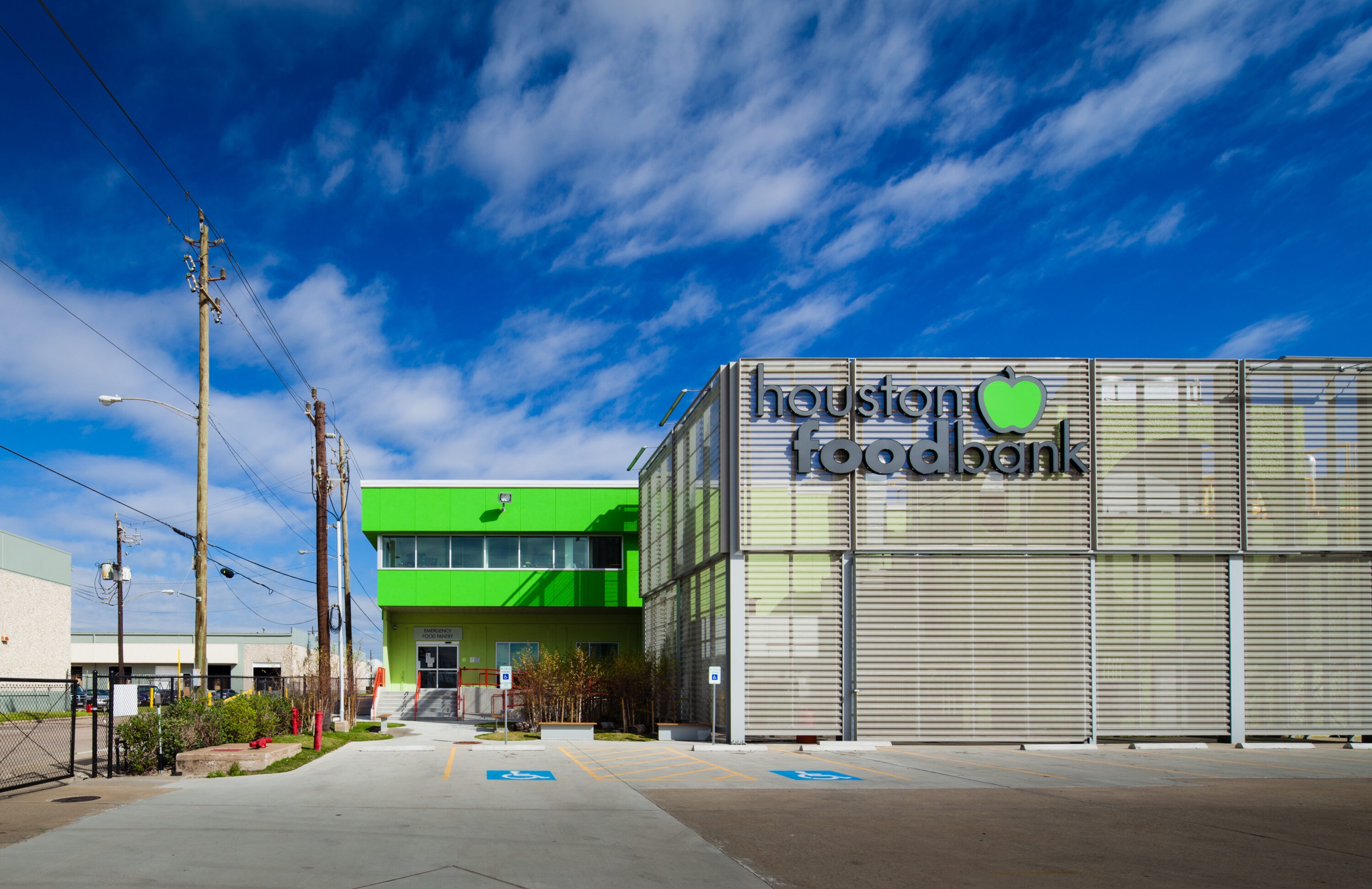 Volunteers assist in sorting and packing donations at the Houston Food Bank, reflecting its commitment to fighting hunger