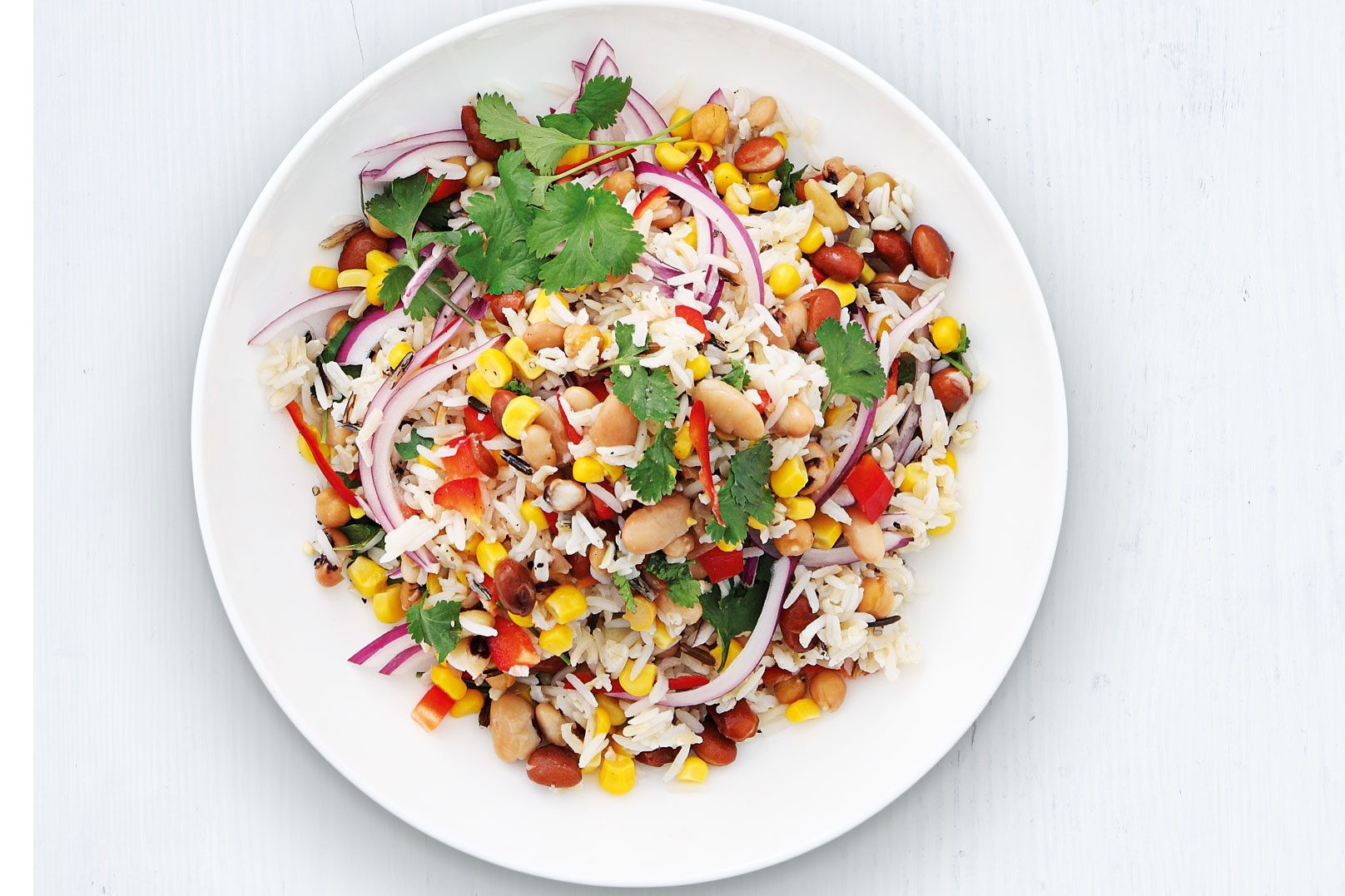 Wild rice with sweetcorn and other vegetables on a plate.