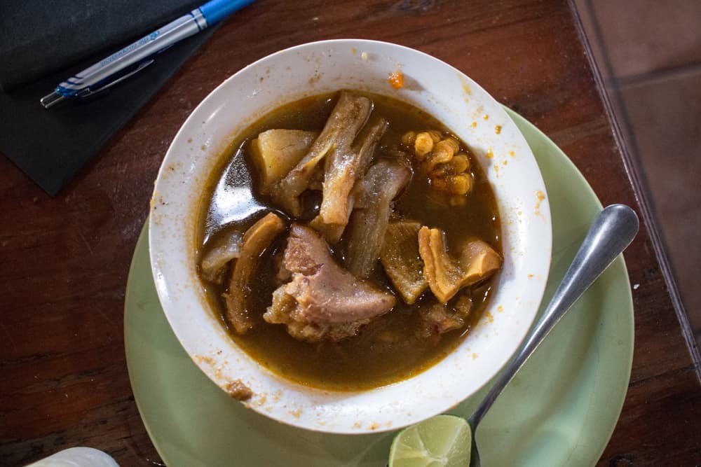 Bowl of soup with meat and corn