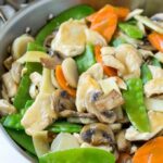 Moo Goo Gai Pan ingredients, including chicken, various mushrooms, and colorful vegetables, showcasing the freshness and variety of the dish.