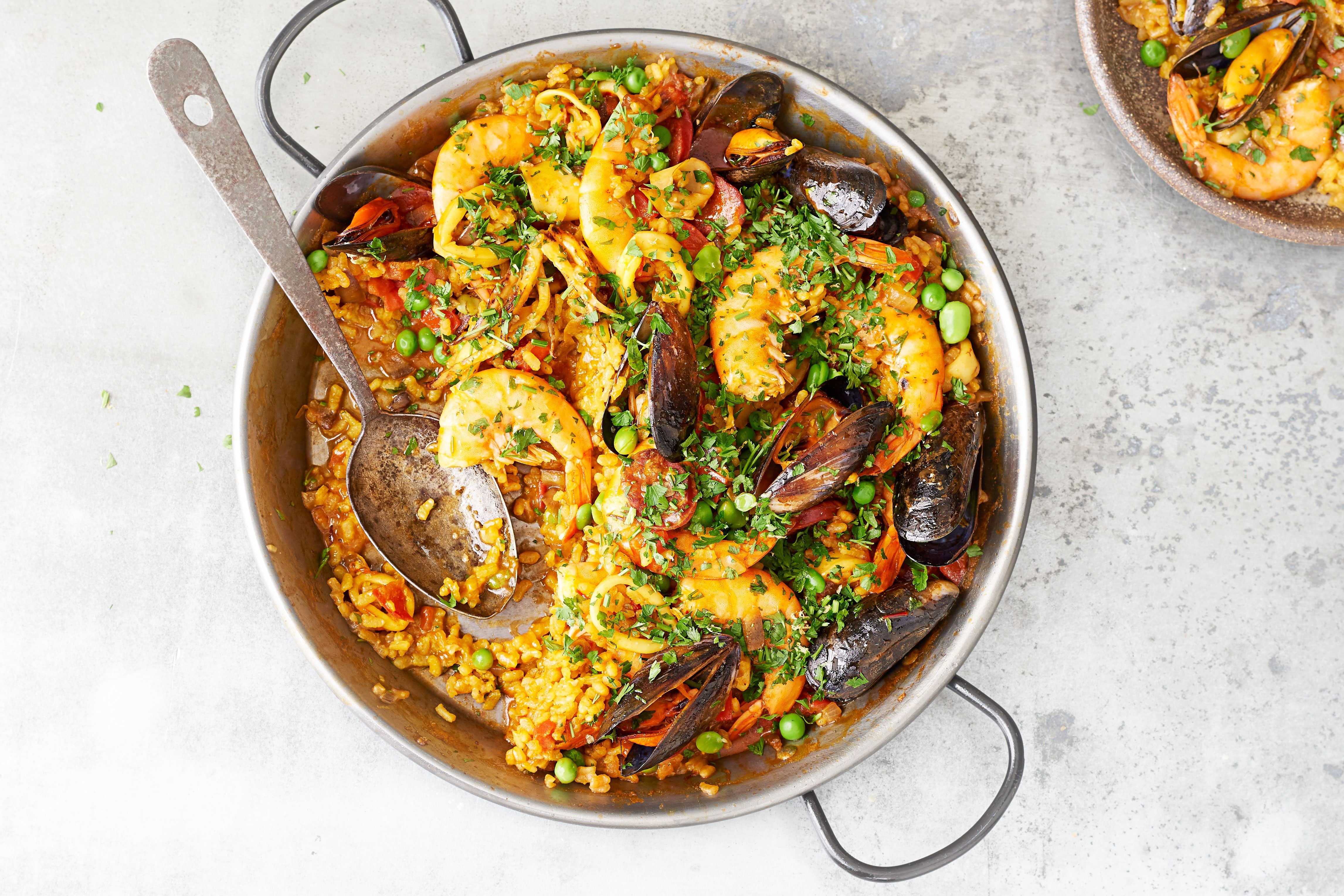 Paella with prawns, mussels, peas and other seafood