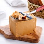 A block of tan-colored norwegian food Brunost