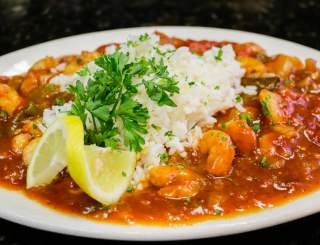 One of the best reasons to visit New Orleans is to savor Crawfish Étouffée, a dish known for its unique flavors and cultural significance