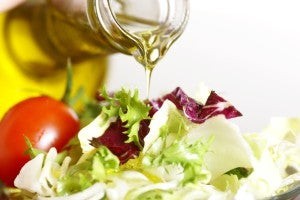 Olive oil and salad for a healthy diet