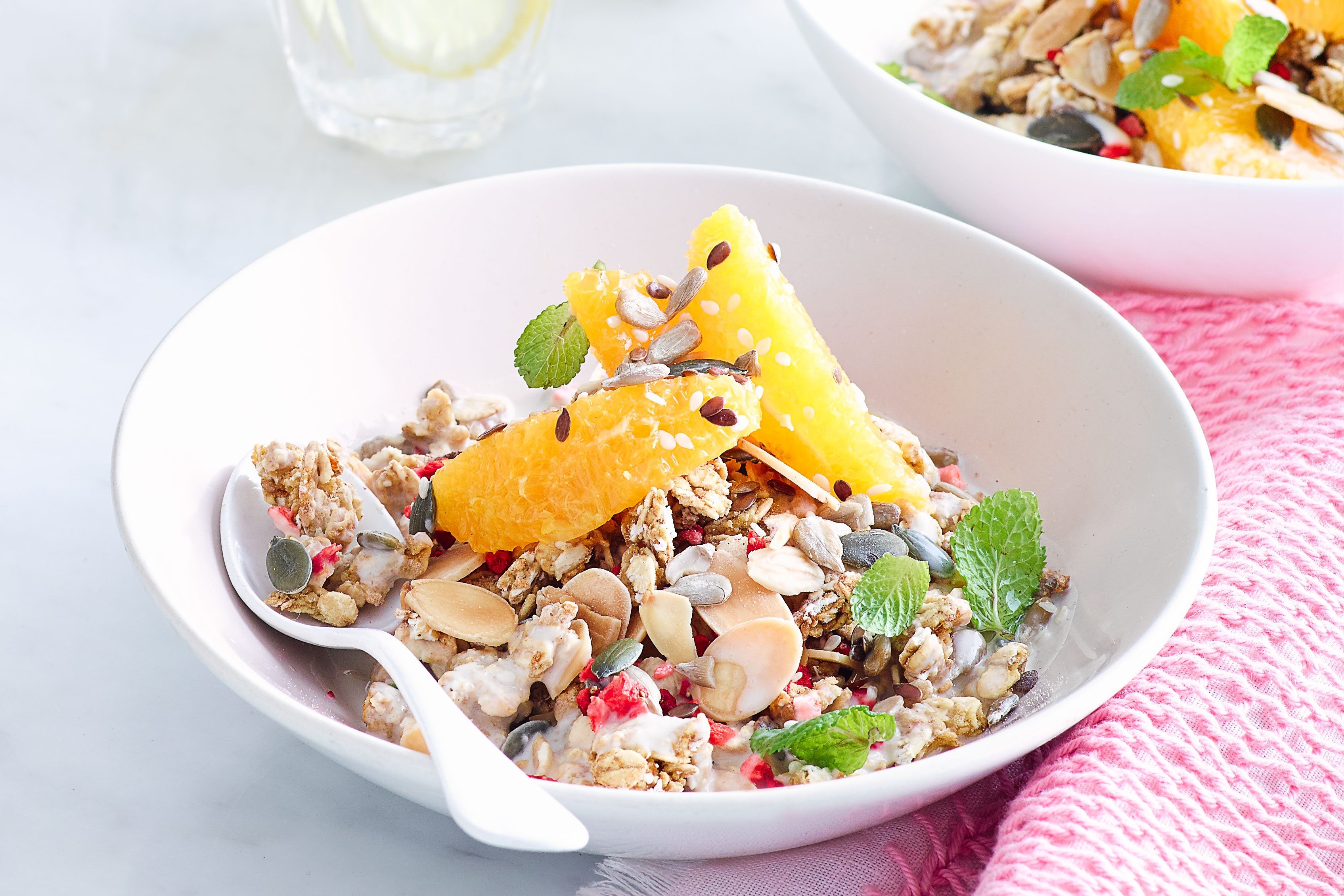 Granola topped with orange and raspberries.