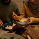Woman sharing food with friend