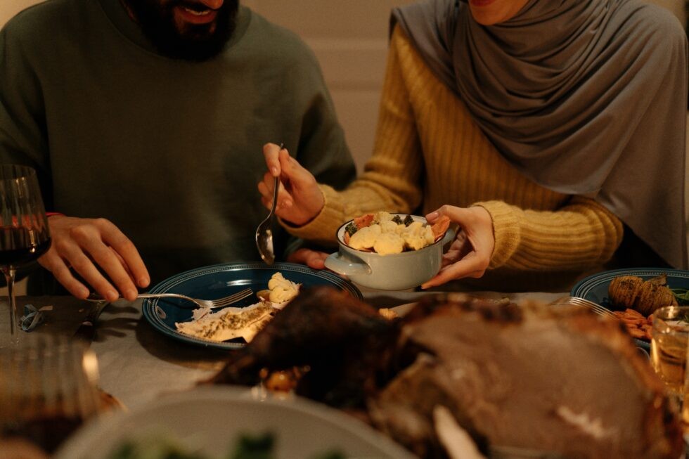 Woman sharing food with friend