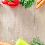 Assortment of colorful anxiety-reducing foods like salmon, spinach, nuts, berries, and avocados
