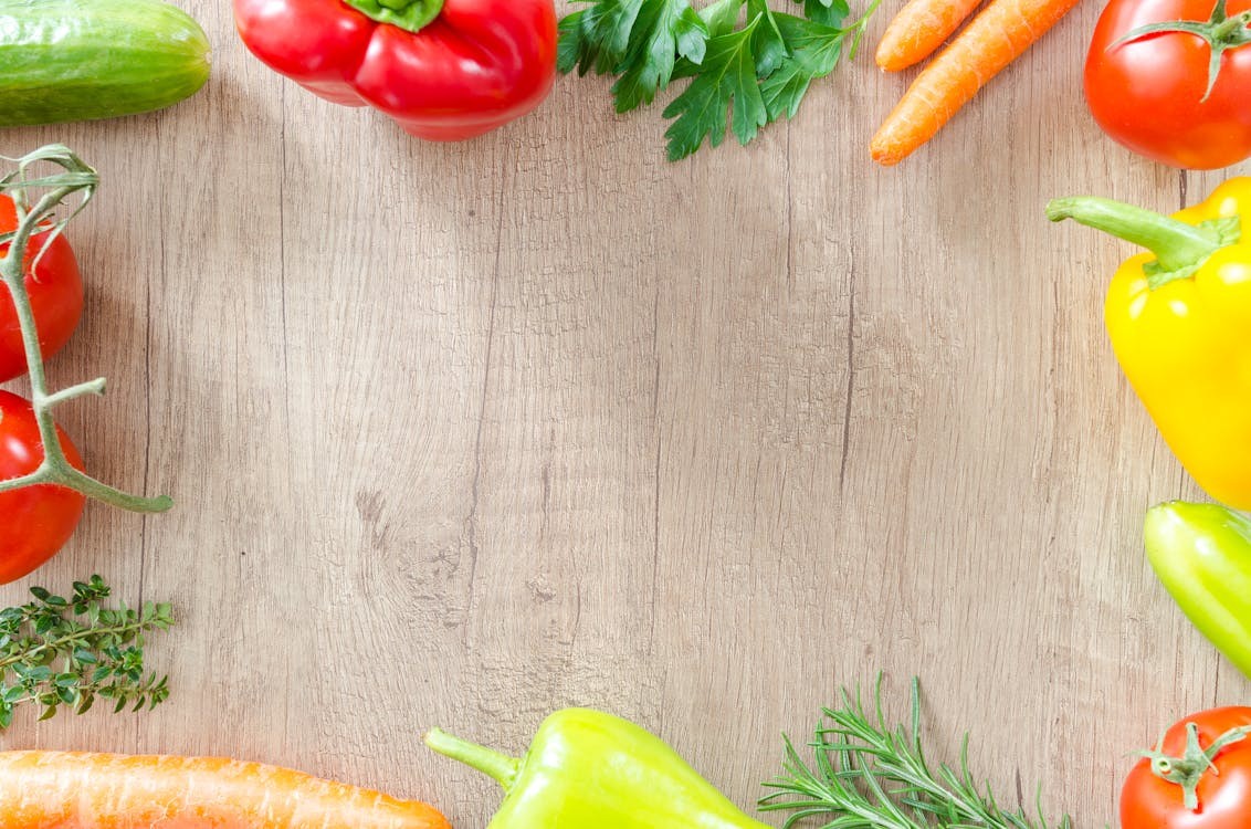 Assortment of colorful anxiety-reducing foods like salmon, spinach, nuts, berries, and avocados