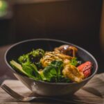 Woman enjoys a healthy meal after a period of fasting