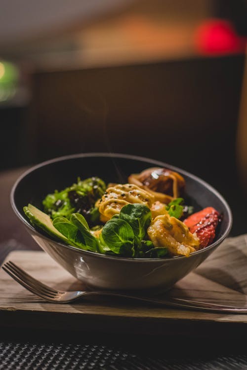 Woman enjoys a healthy meal after a period of fasting