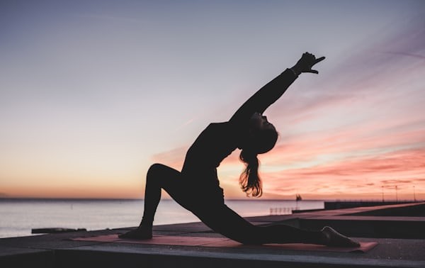 A person practicing yoga in a peaceful setting