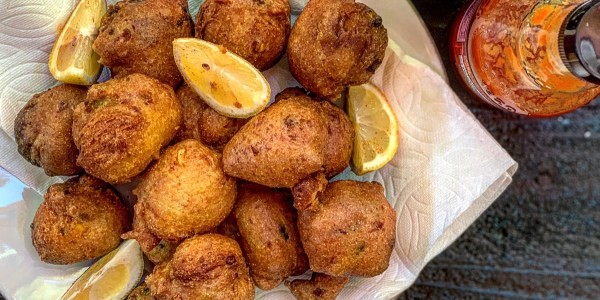 Ryan Scott presenting green chile hushpuppies, showcasing a creative dish that can be made with frozen ingredients.