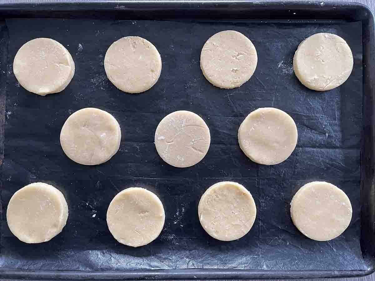 French biscuits cut in rounds on a baking tray