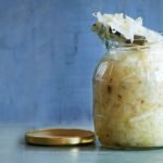 Fermented foods like kimchi and sauerkraut promote gut health by introducing beneficial bacteria