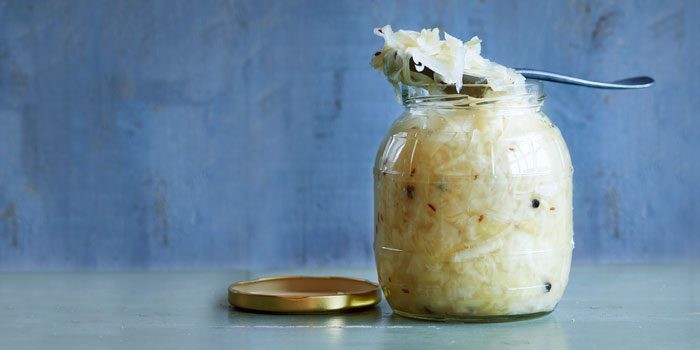 Fermented foods like kimchi and sauerkraut promote gut health by introducing beneficial bacteria