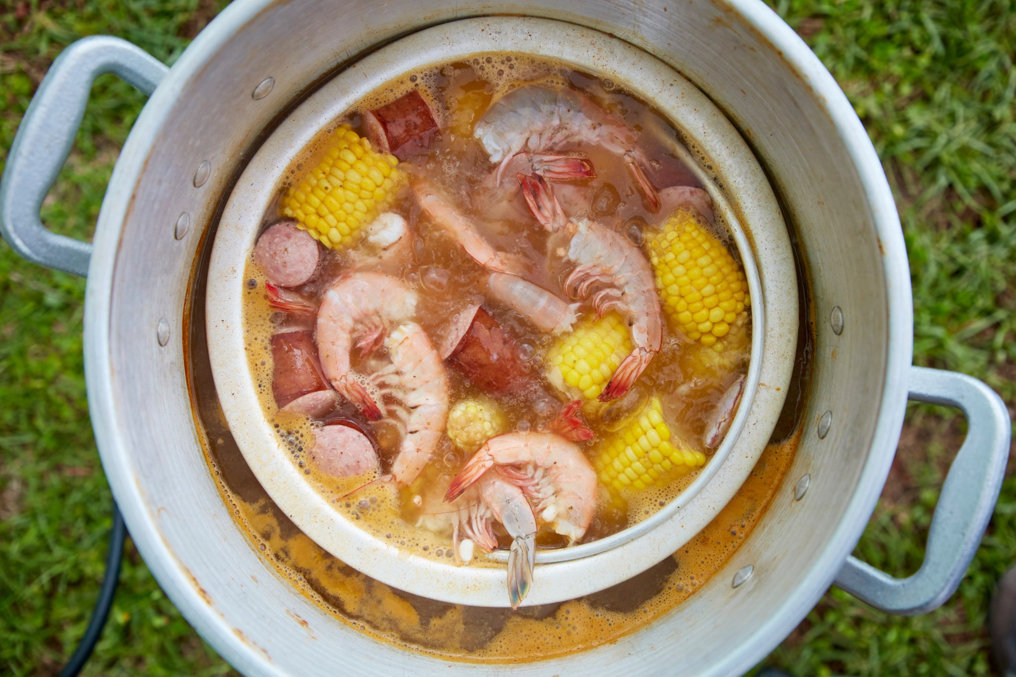 Frogmore Stew, a South Carolina specialty, featuring shrimp, sausage, corn, and potatoes, showcasing the communal dining experience