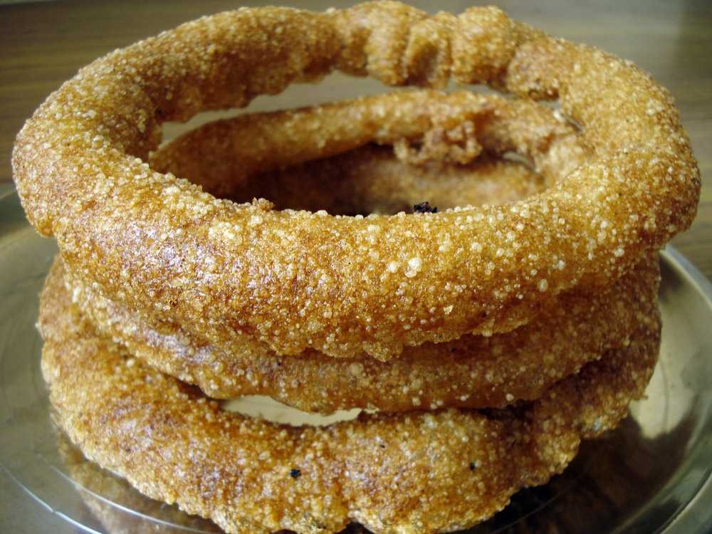Crispy Sel Roti, a traditional homemade, ring-shaped sweet rice bread
