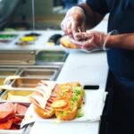 Serving food with gloves