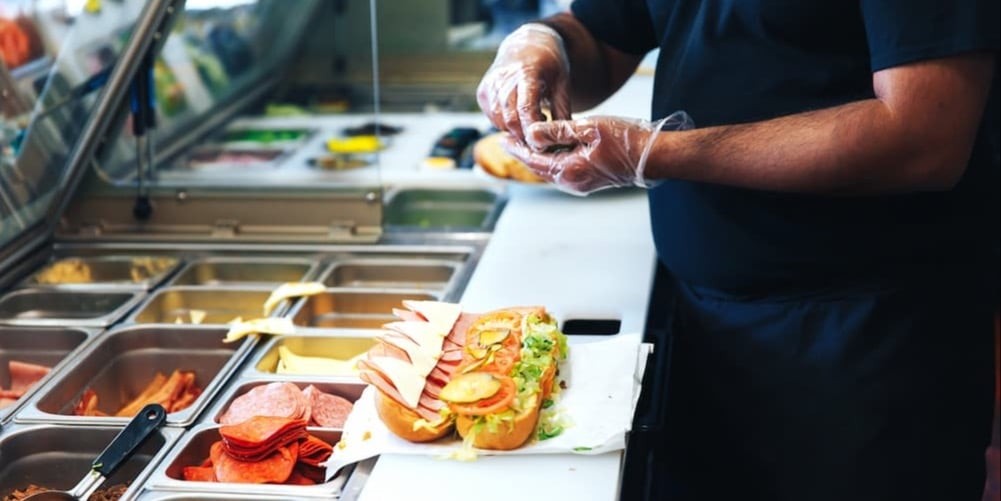 Serving food with gloves