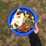 Campfire Breakfast Burritos with scrambled eggs, sausage, cheese, onions, and peppers in tortillas