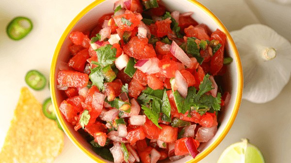 Fresh pico de gallo, a zesty salsa to brighten up your tamales