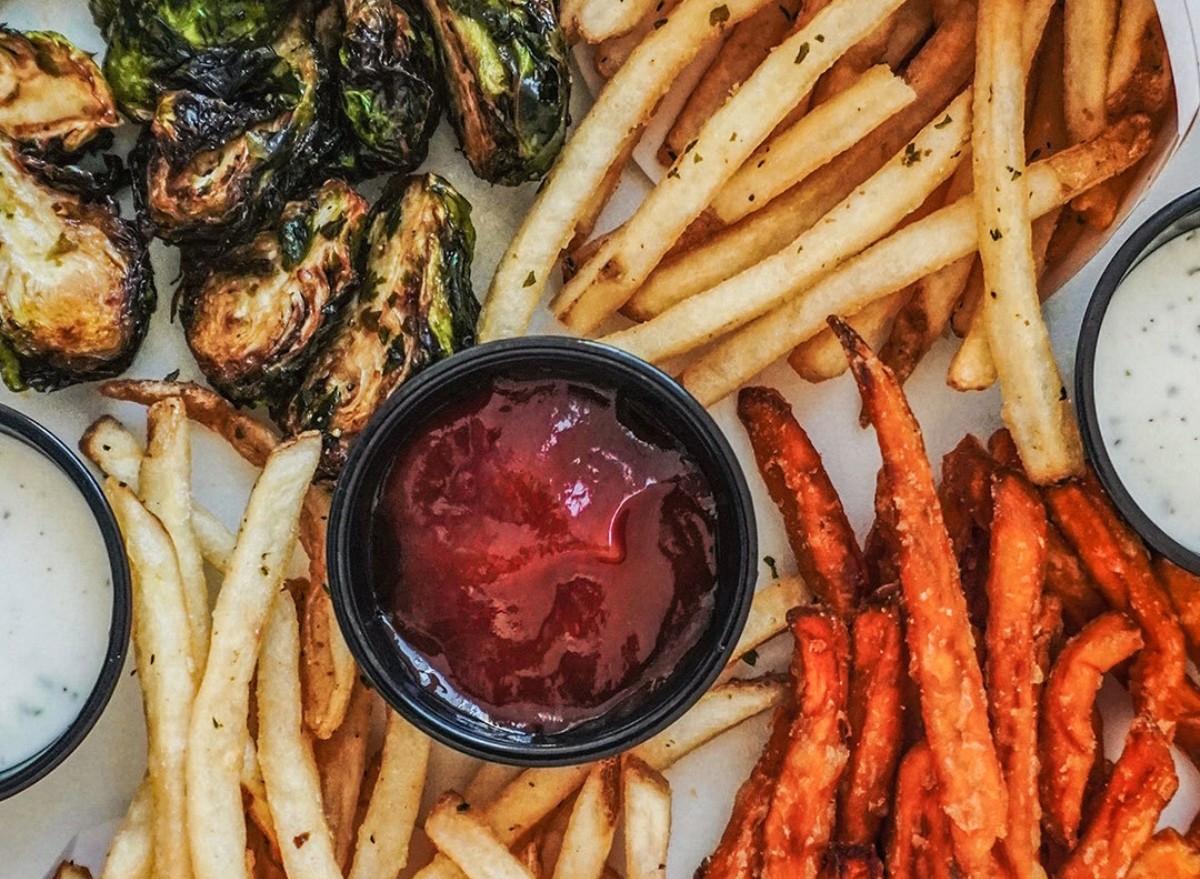 Smashburger's crispy brussels sprouts, regular fries, and sweet potato fries, showcasing rosemary seasoning