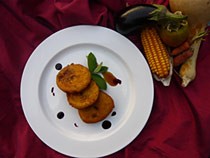 Sopaipillas Pasadas coated in chancaca