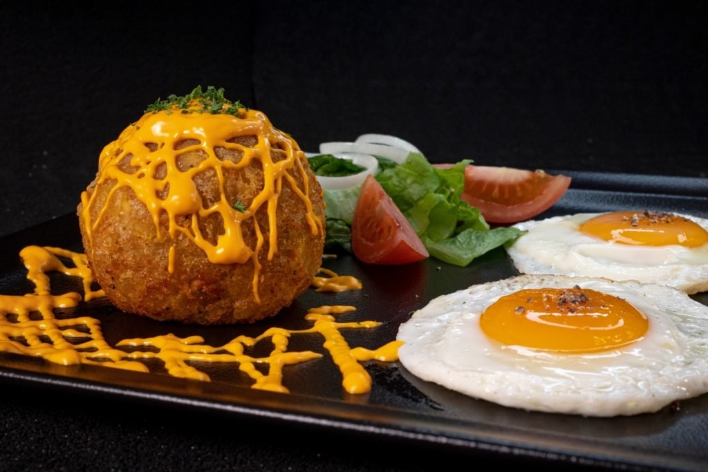 Bolon de Verde with a fried egg
