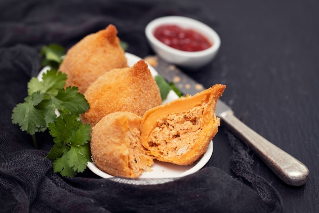 Sliced Coxinha revealing the filling