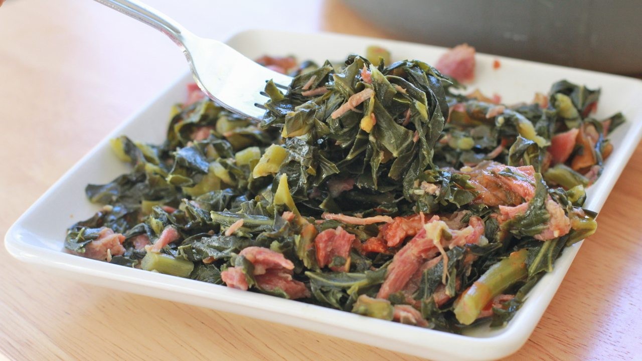 Fresh collard greens being prepared for cooking