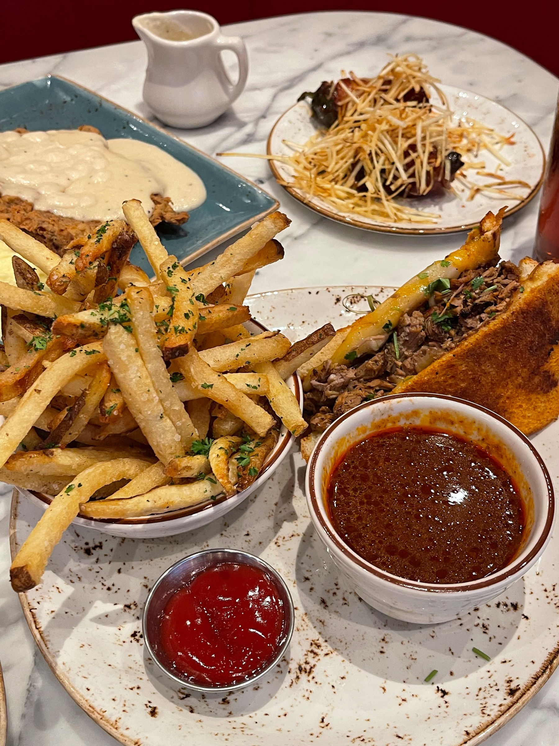 The birria sandwich and truffle fries at State Fare is a must-try during lunchtime