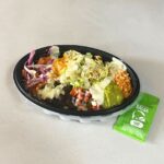 Taco Bell Cantina Chicken Power Bowl - A balanced and nutritious fast food option with seasoned rice, black beans, chicken, and fresh toppings