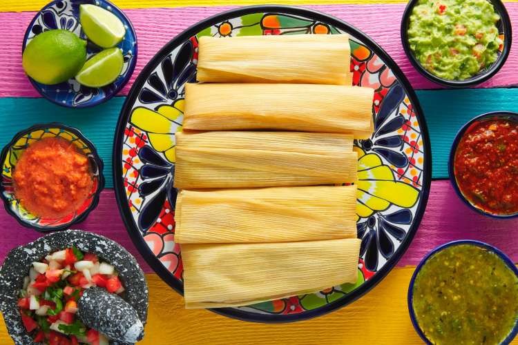 Tamales served on a colorful plate