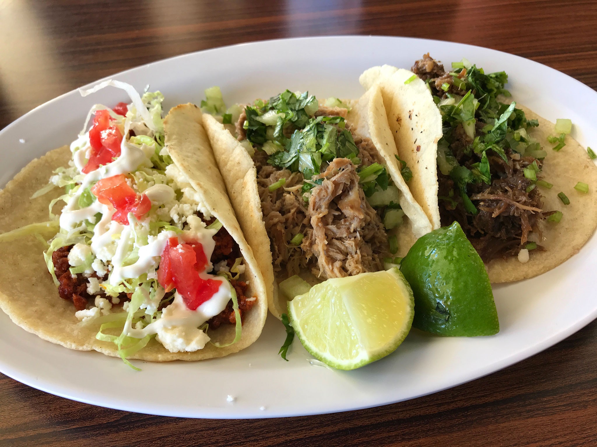 Assortment of flavorful tacos from Taquitos Mexican, featuring chorizo, carnitas, and barbacoa