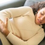 Woman experiencing nausea from food poisoning
