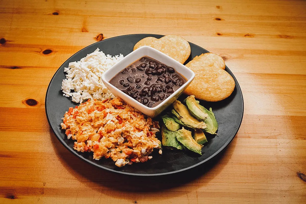 A plate of Perico, showcasing its vibrant colors and savory ingredients