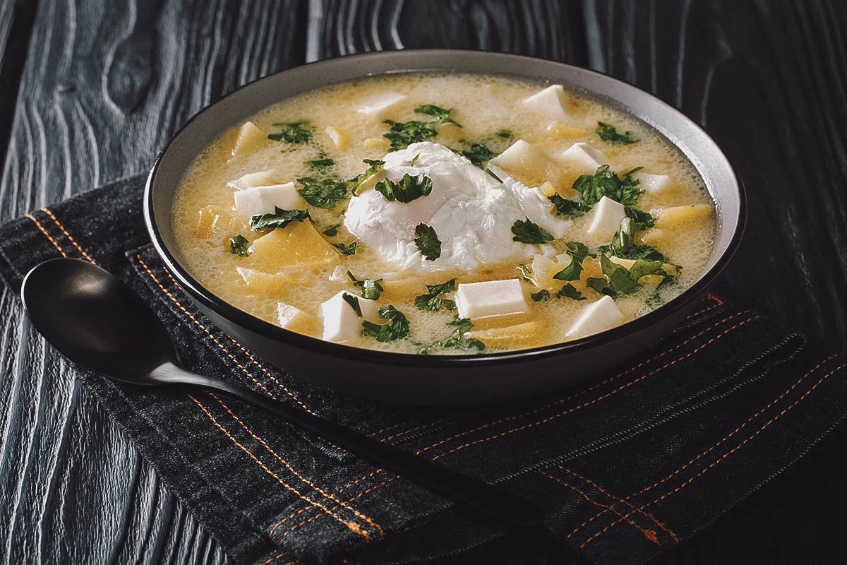 A bowl of Pisca Andina, showcasing its creamy texture and comforting ingredients