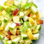 Diced apples for waldorf salad, showcasing the preparation of fresh ingredients