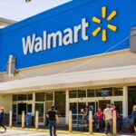 Shoppers walk in an out of Walmart store.
